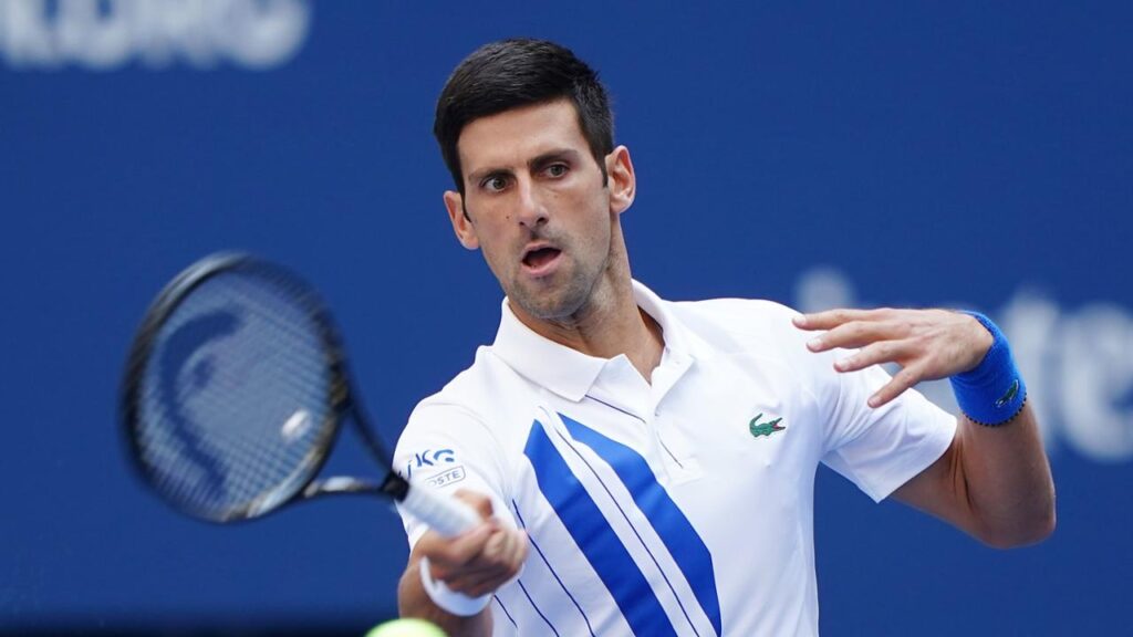 alt="Novak Djokovic battles P.Carreño Busta at US Open"