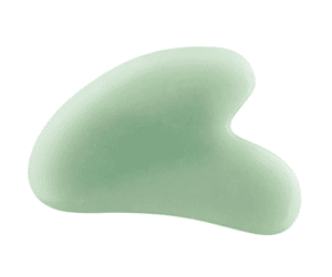 Photo of a Gua Sha, a green smooth stone with a heart-shaped indent in the stone to use on jawline, etc. 