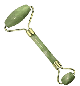 Photo of a green jade roller with dual-sided rollers, one being larger than the other
