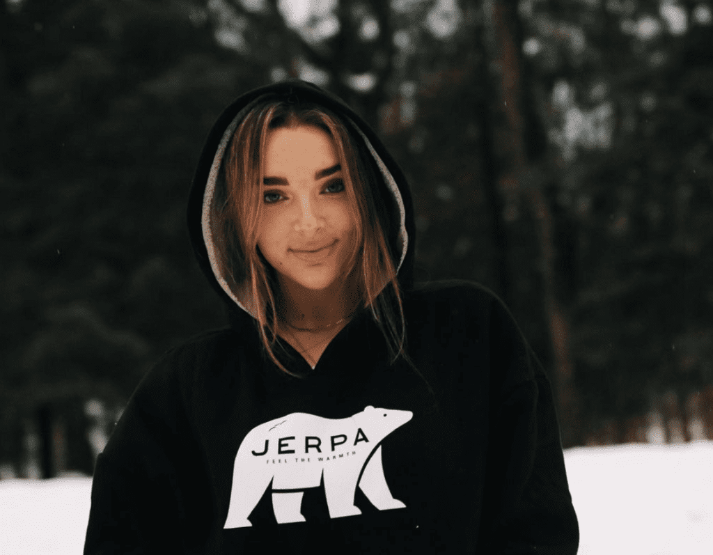 Photo of Kendall Vertes wearing JERPA sherpa-lined hoodie in dark black