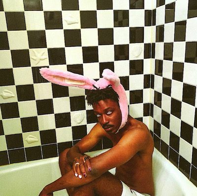 LA rapper SEB poses for a shot in the bathtub