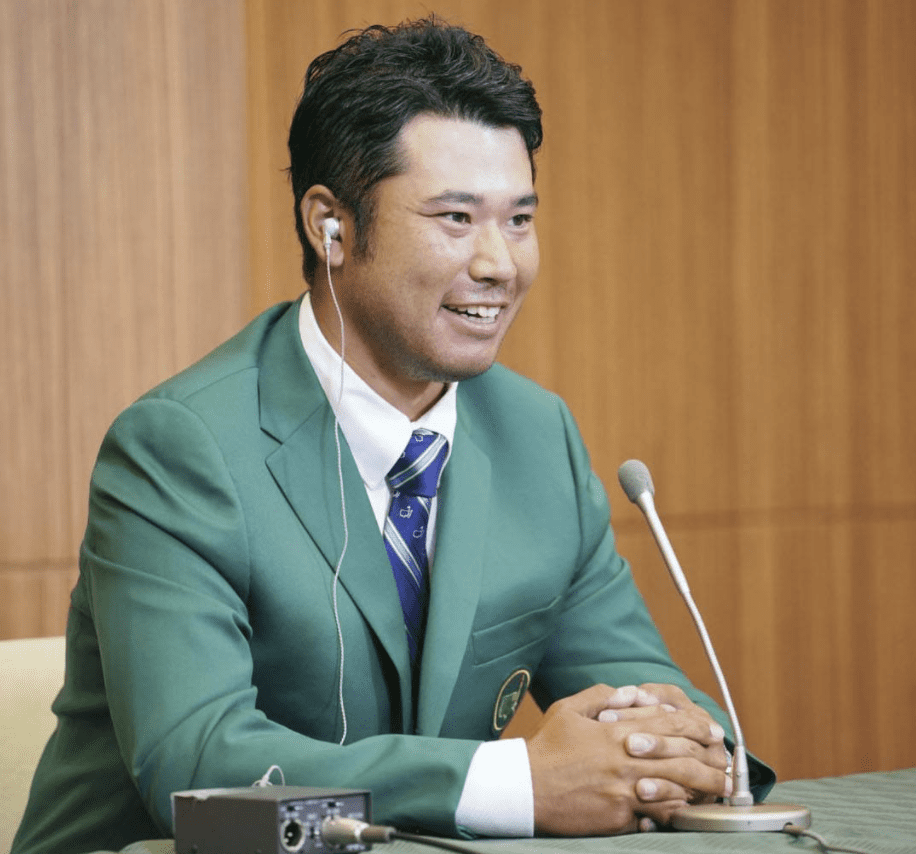 Photo of Hideki Matsuyama in his green coat