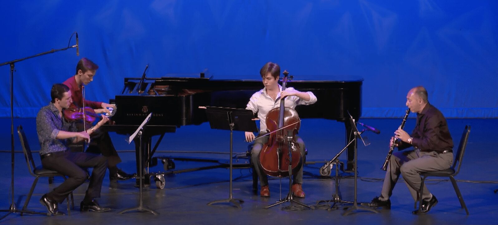 The Zandieh Trio and their father performing Charles' first composition (screenshot from the live stream)