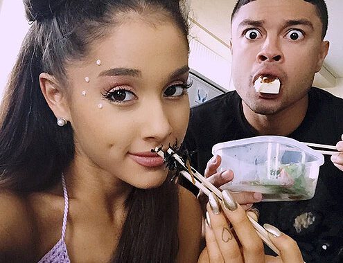 Ariana and her male friend eating food.