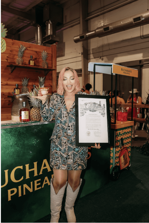 Yvonne Guidry Raises a Glass of Buchanan’s Whisky To Celebrate Her Proclamation at the 2nd Annual Spoiled Latina Summit in Houston, TX