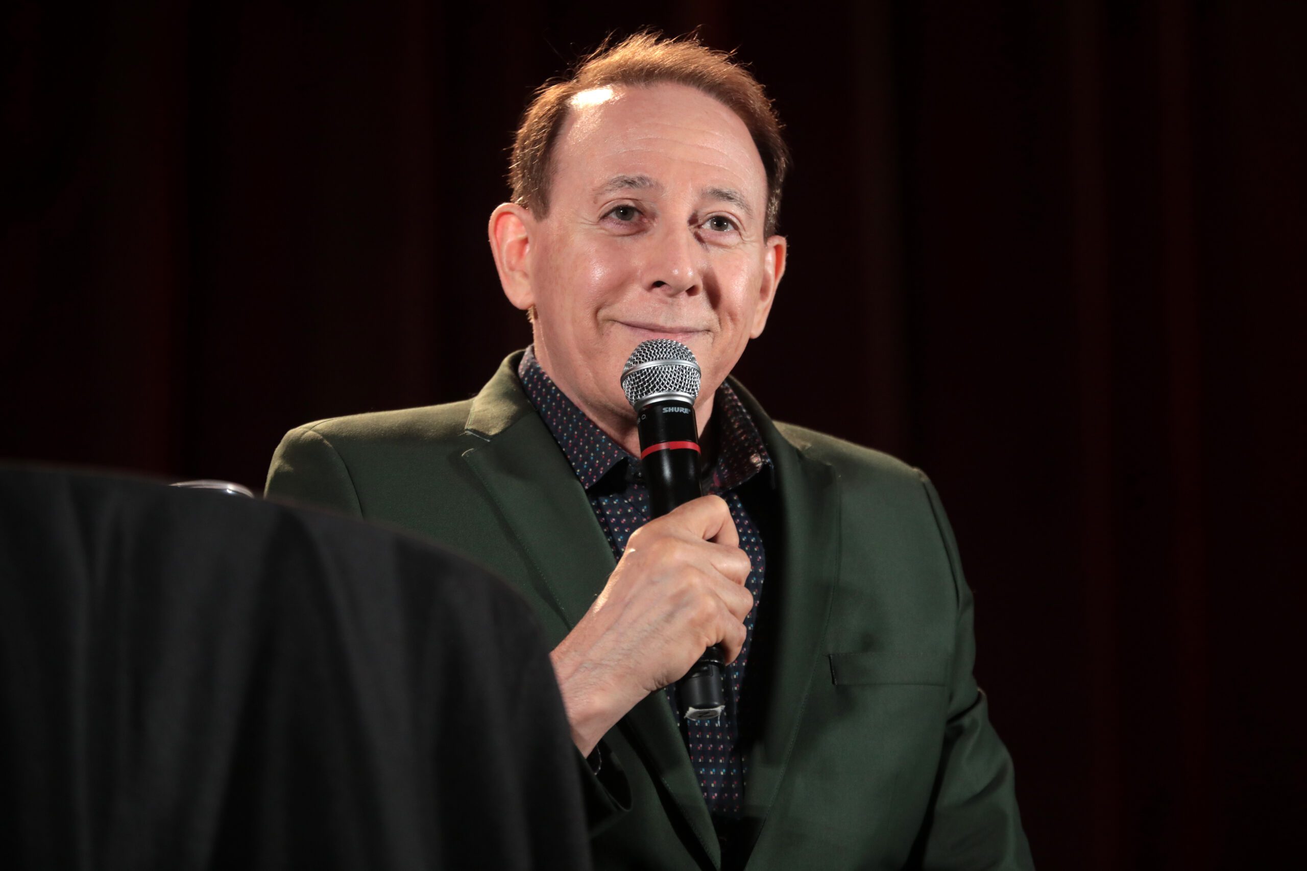 Paul Reubens speaking at a convention