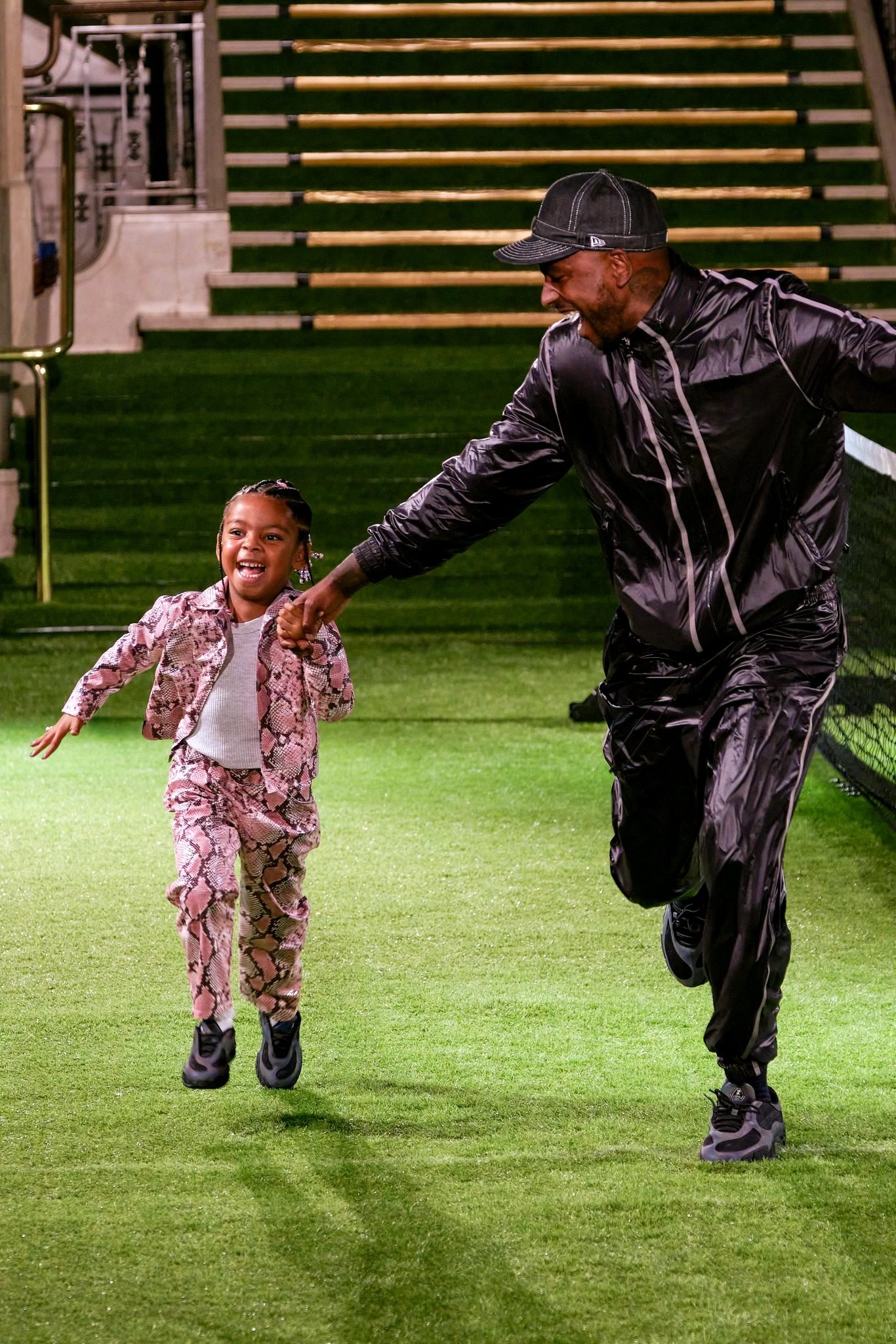 Skepta with his daughter at the Mains show