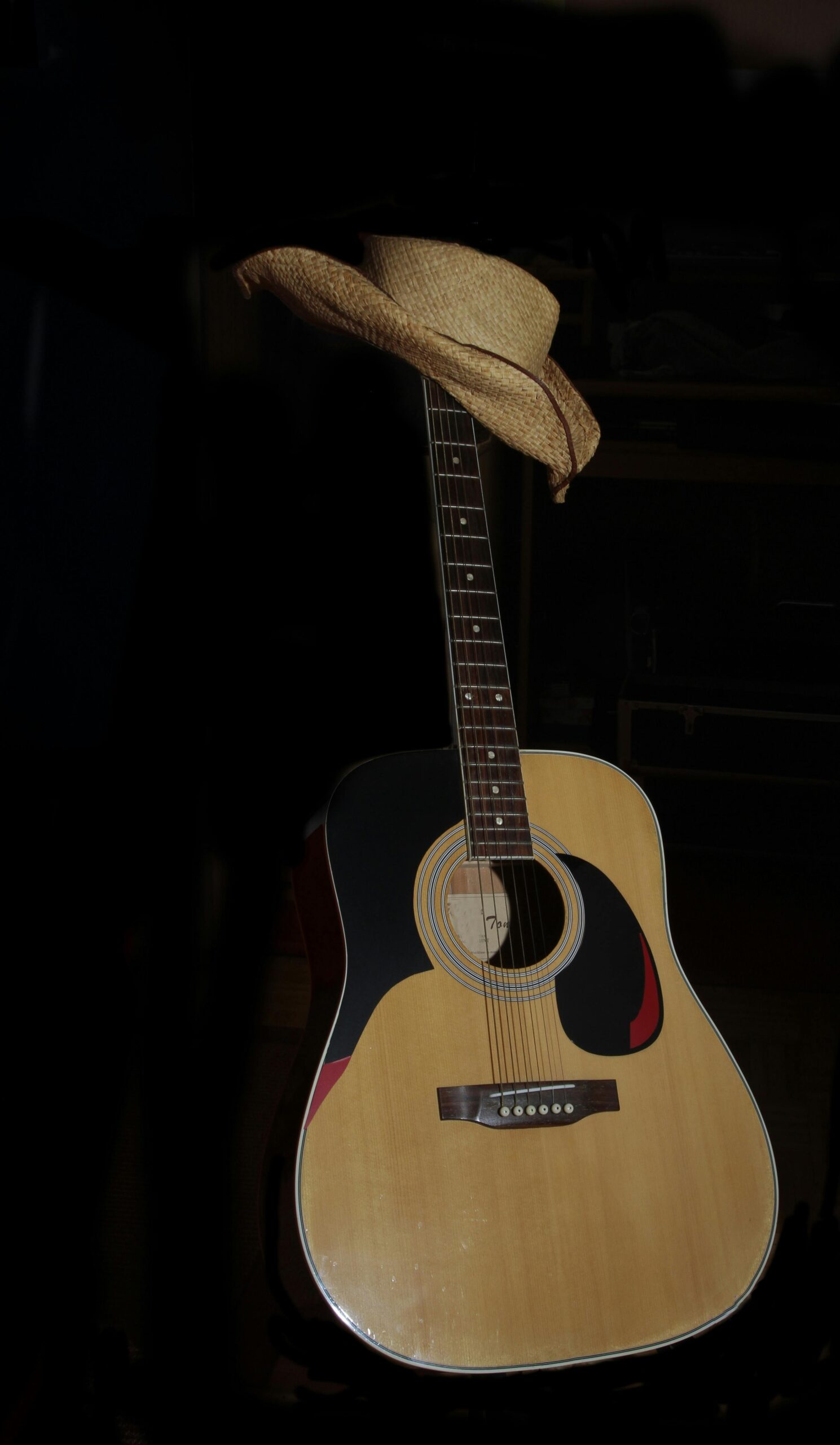 guitar with western style cowboy hat